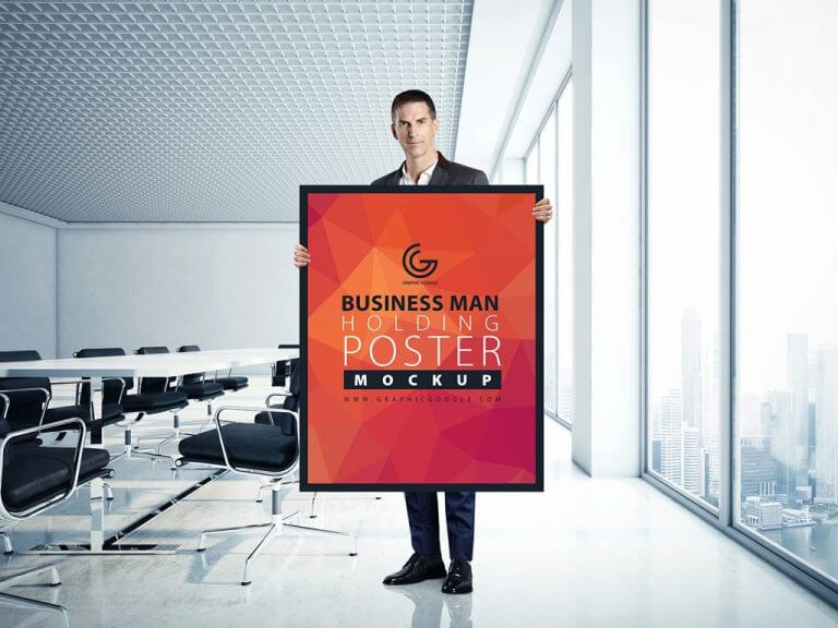 Businessman holding Poster Mockup
